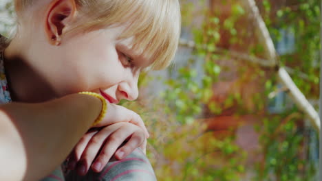 A-6-Year-Old-Girl-In-Sunglasses-Looks-Out-The-Window-1