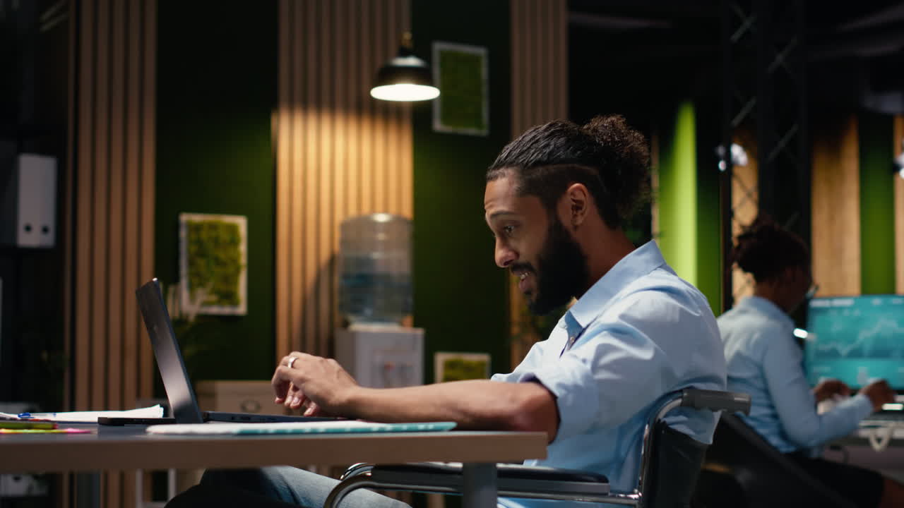 Middle Eastern businessman in wheelchair using video call conference