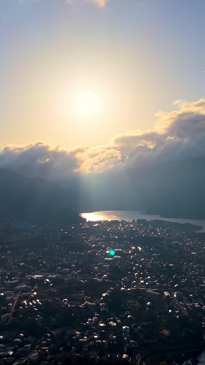 Aerial drone view of Lake Kawaguchiko near the Fujikawaguchiko town, Japan at sunset