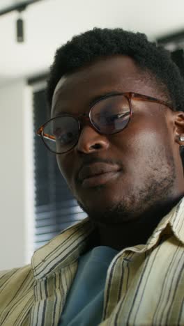 close-up of a man wearing glasses