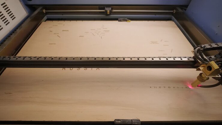 Cnc laser cutting machine cuts wooden plank and plywood. Timelapse