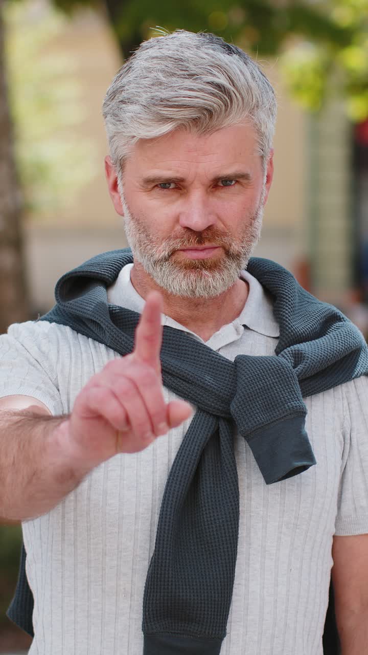 Man reacting to unpleasant awful idea dissatisfied with bad quality wave hand finger shake head no