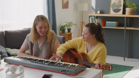 girl with down syndrome having music class with teacher