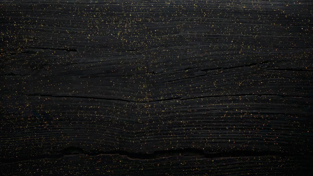 Falling stream of gold glitter descending from above, settling, decorating dark plank near grass