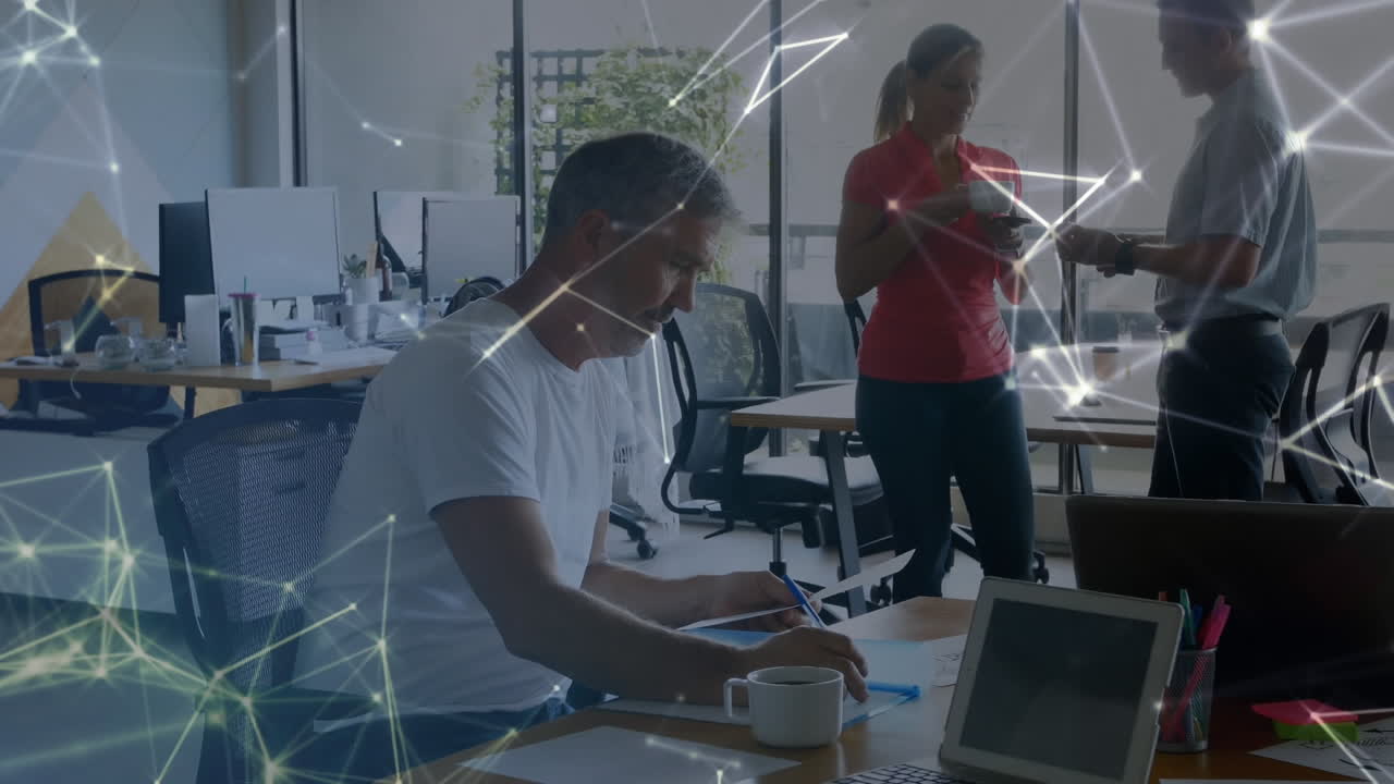 Web of connections against senior man taking notes