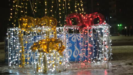 christmas decorations on a tree at night