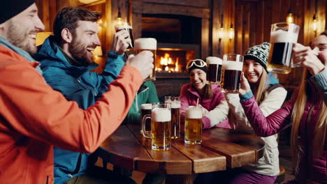 Friends Celebrating with Beer at a Ski Lodge