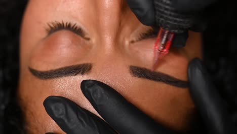 microblading, permanent makeup or tattooing of eyebrows by professional