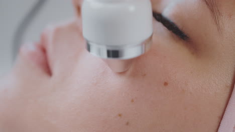 woman receiving facial treatment