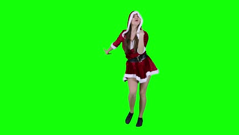 Happy-and-energetic-Caucasian-female-dancer-performing-in-front-of-the-green-screen-wearing-a-Christmas-dress