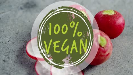 animation of 100 percent vegan text banner against close up of red radish on grey surface