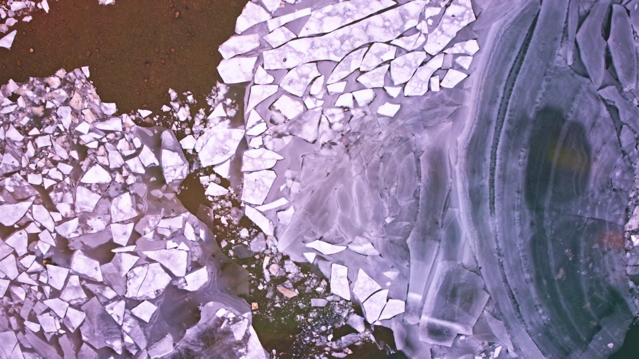 High drone shot capturing beautiful frozen ice formations on the Great Lakes in northern Michigan.