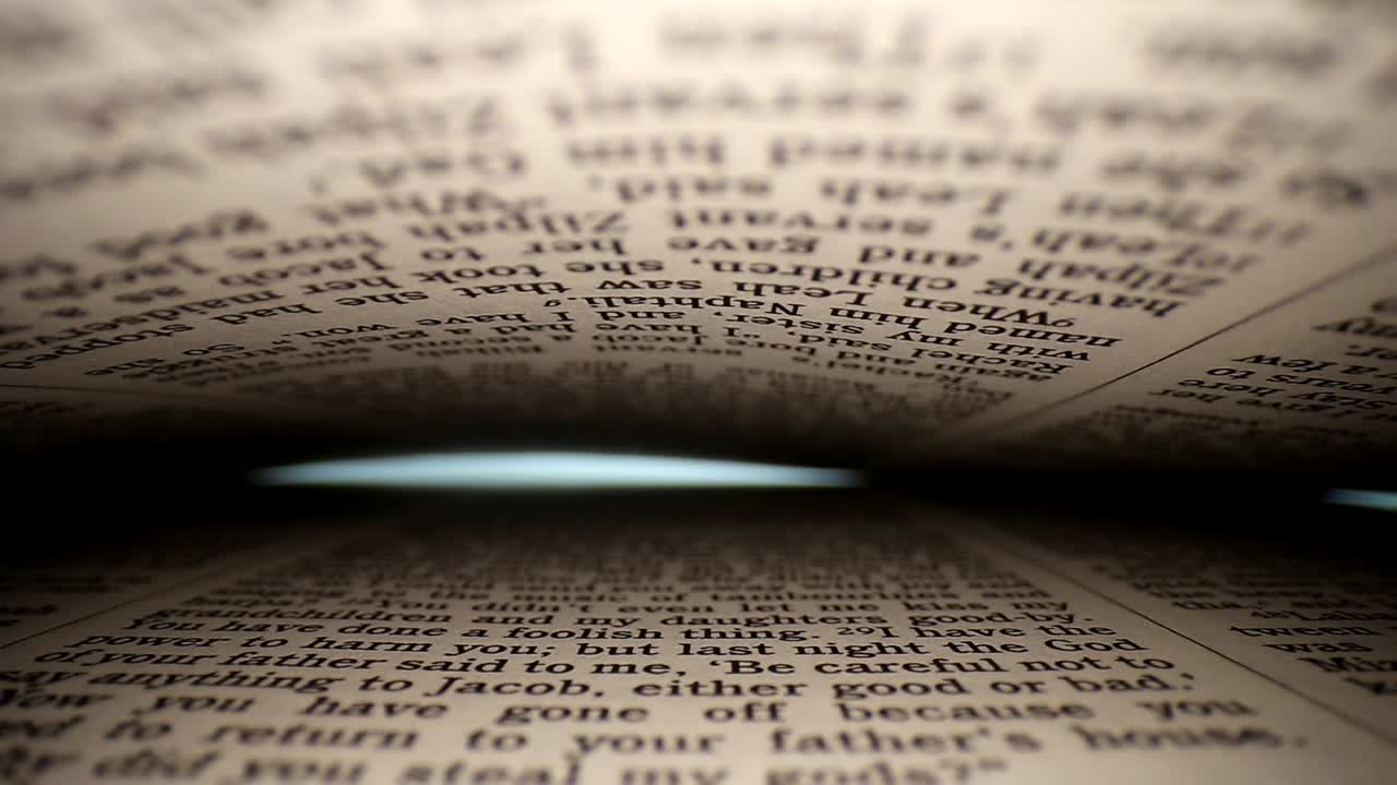 Slowly pulling lens out of book