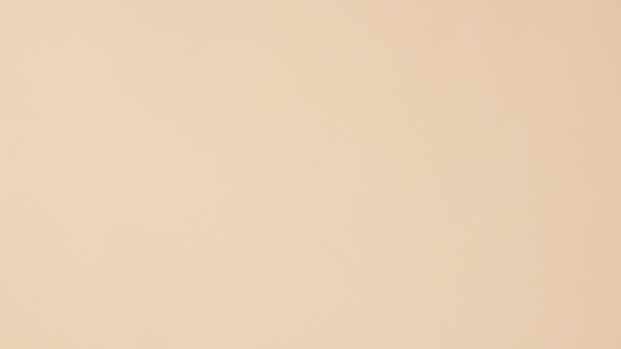 Vintage old books half opened appear on beige background with copy space. Stop motion flat lay