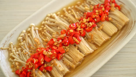 homemade steamed golden needle mushroom or enokitake with soy sauce, chilli and garlic