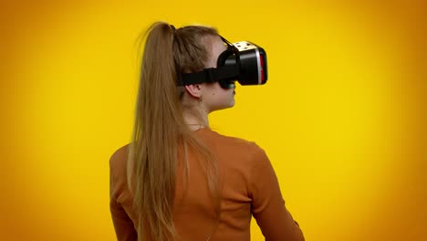 girl using virtual reality futuristic technology vr headset helmet to play simulation 3d video game