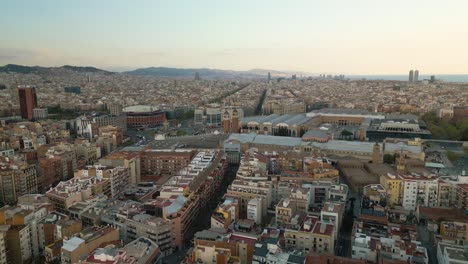 flying over apartment buildings towards the venetian towers and plaza of spain