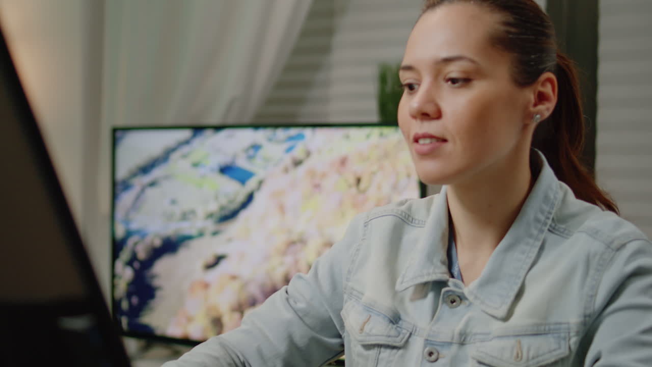 Photographer working with touchscreen monitor for photo editing