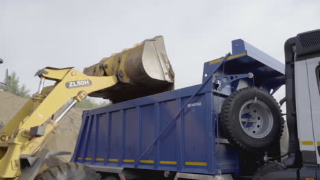 excavator loading dump truck