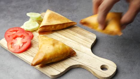 delicious samosas with tomato and cucumber