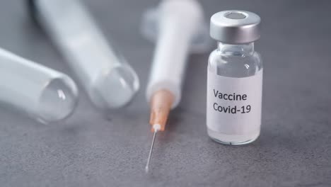 covid-19 vaccine and syringe