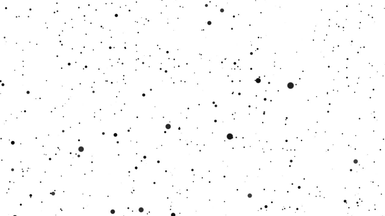 De grandes et petites particules noires se déplacent de manière chaotique sur un fond blanc. Beau bokeh monochrome.