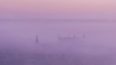 magnificent landscape of medieval palace in foggy dusk