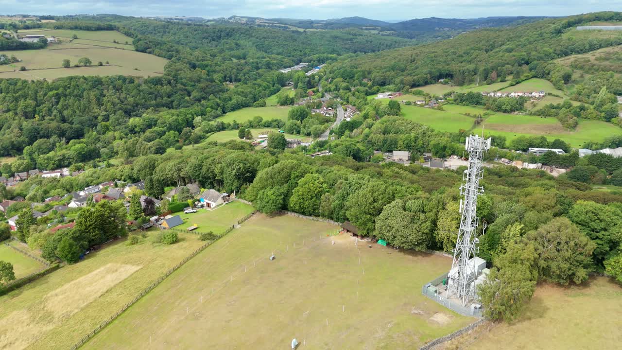 Drone aerial perspective of green countryside and mountains with hills in Ambergate Derbyshire Dales United Kingdom