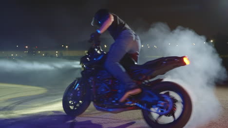 motorcycle wheelie at night