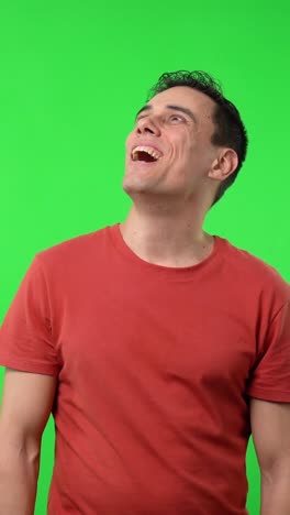 man smiling on a green screen