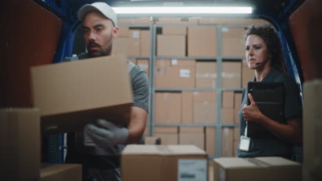 delivery team loading packages in a warehouse or van