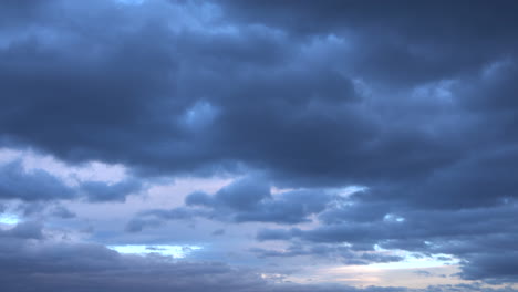 black clouds give way to night as it grows dark