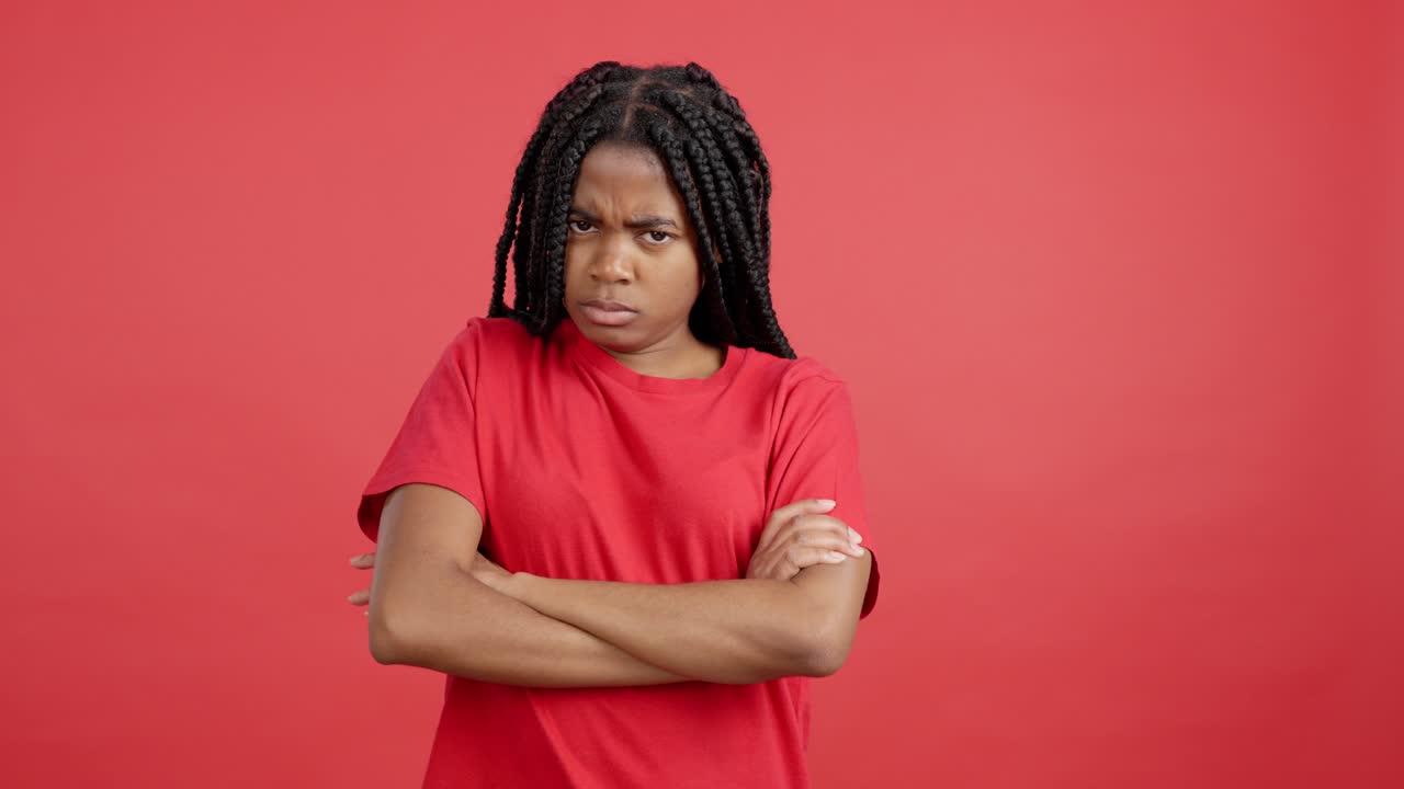 Woman with braids and arms crossed