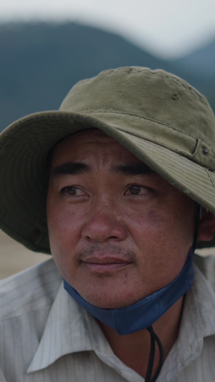 Portrait of a man wearing a hat and face mask