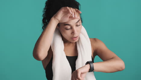 african american satisfied woman over blue background.