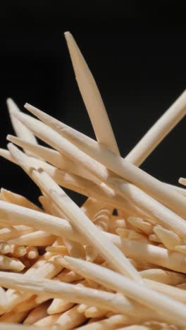 noodles atop dark background resembling intertwined hardwood lumber a detailed view of noodles arranged on a black surface resembling a pattern of natural materials like wood or plywood