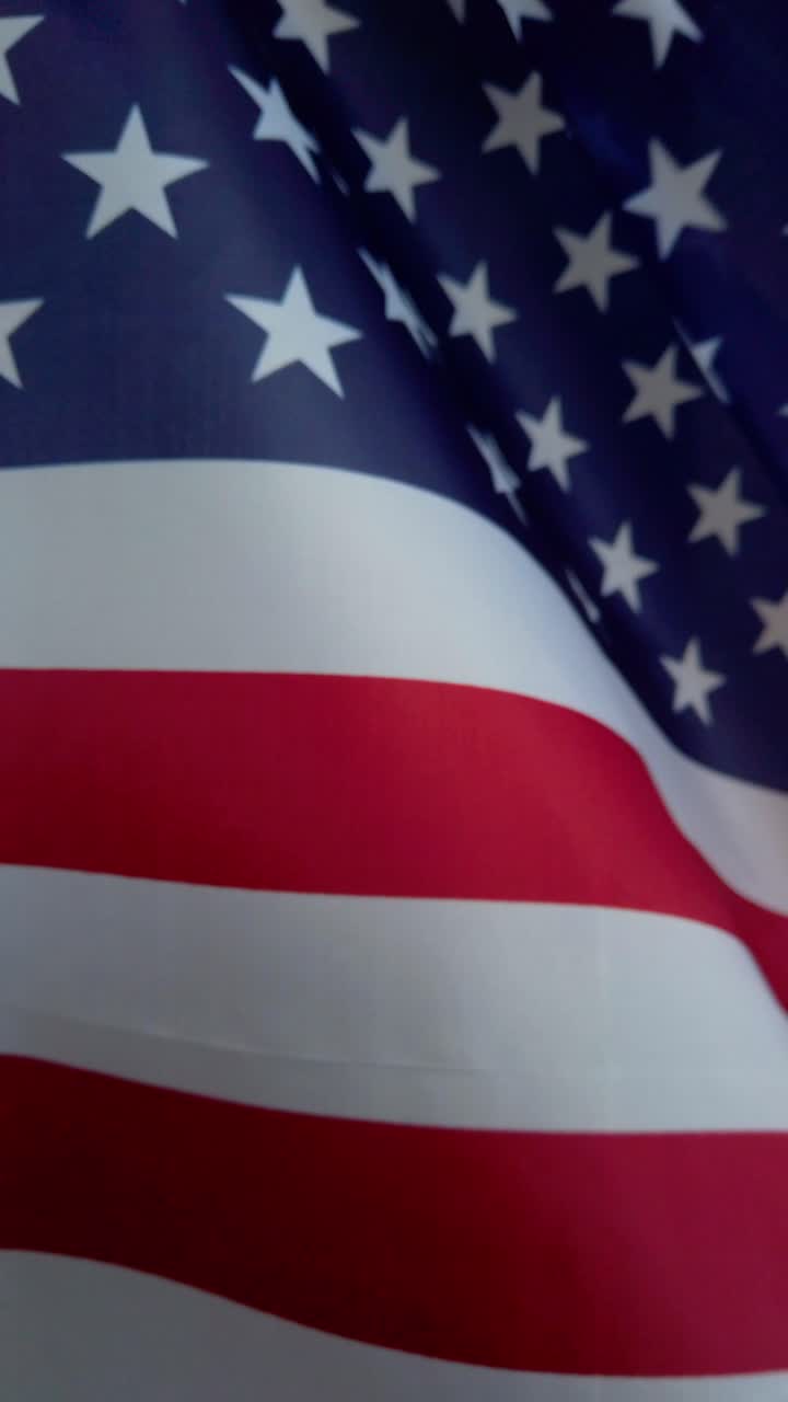 Close-up view of six American flags waving