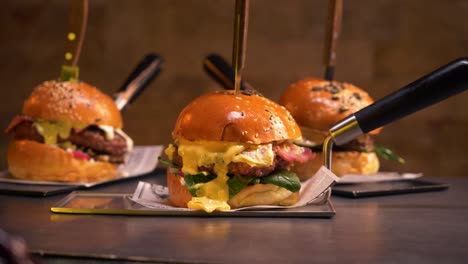 beef burgers with melting cheddar meal close up