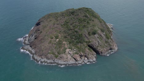 Aerial-View-Of-Bluff-Rock-Reef-Hit-By-Ocean-Waves-In-Australia