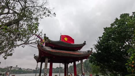 pavilion with flag amidst trees in hanoi