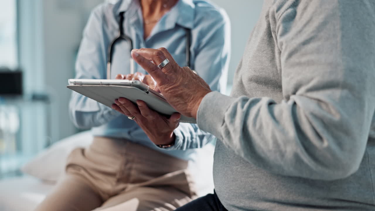 Doctor and patient using a tablet for a consultation