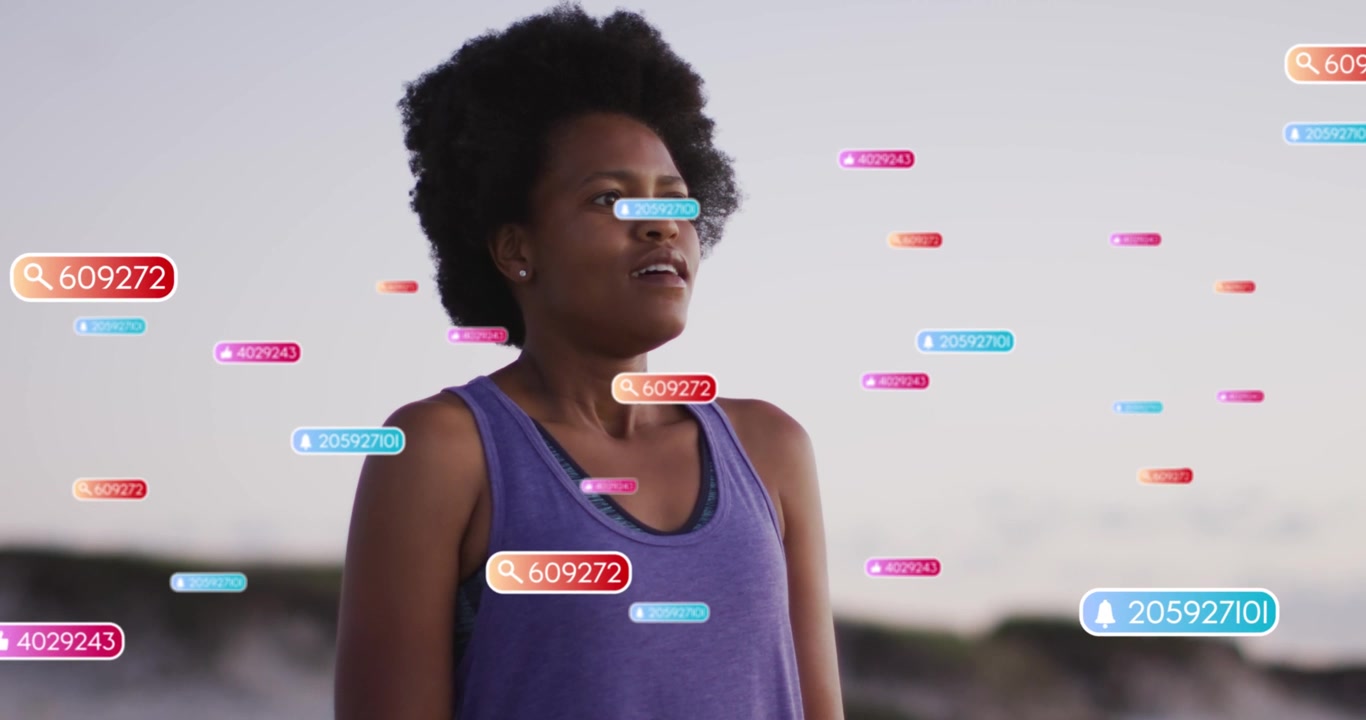 Woman standing on coast, badges appearing, increasing and floating around her visualizing tech data