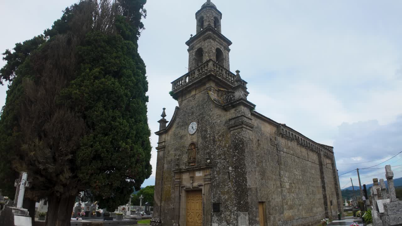 Stone cross atop the roof of Santo Eusebio da Peroxa church in Coles, Ourense, Galicia, Spain