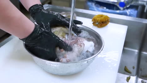 A-chef-cleans-octopus.-Raw-seafood