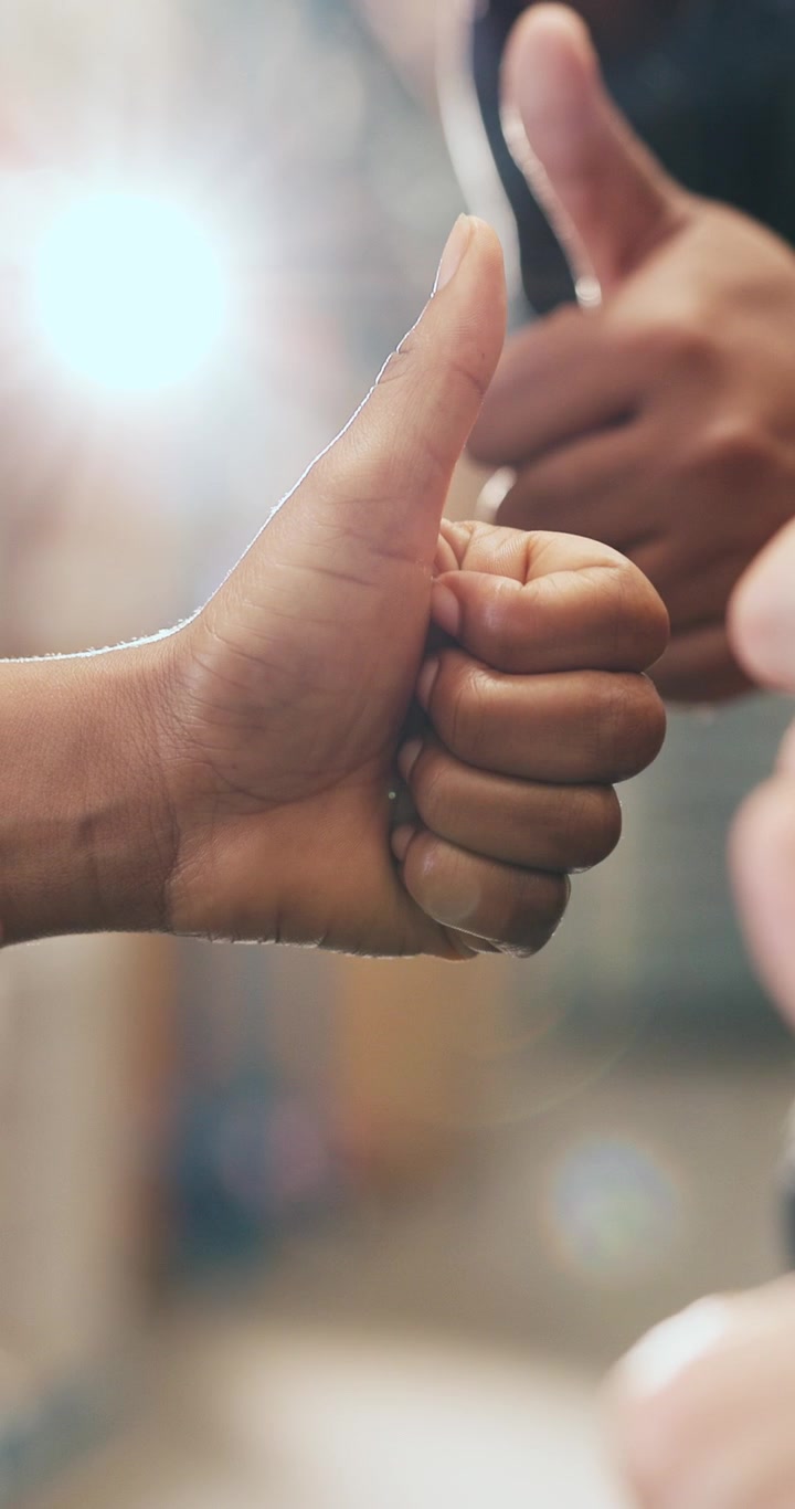 Close-up of People Giving Thumbs Up Gesture