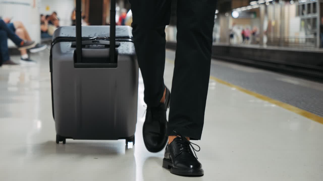 Person with luggage at a train station