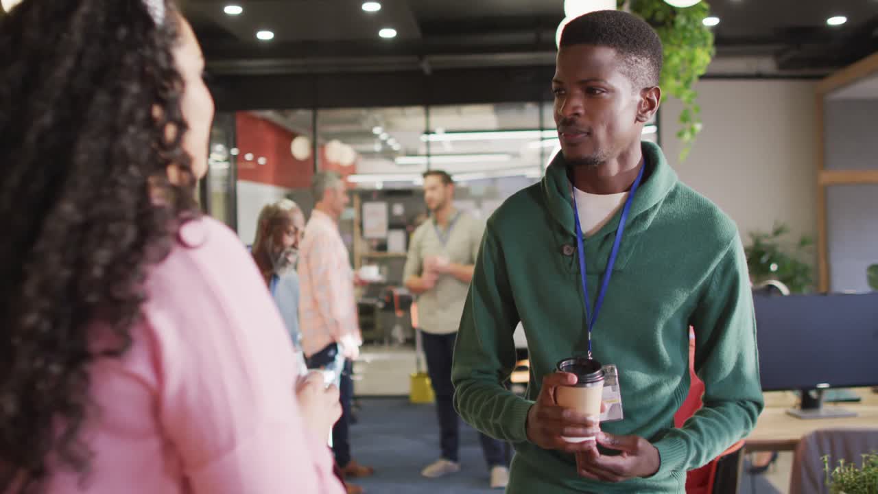 Happy diverse business people discussing work during meeting at office
