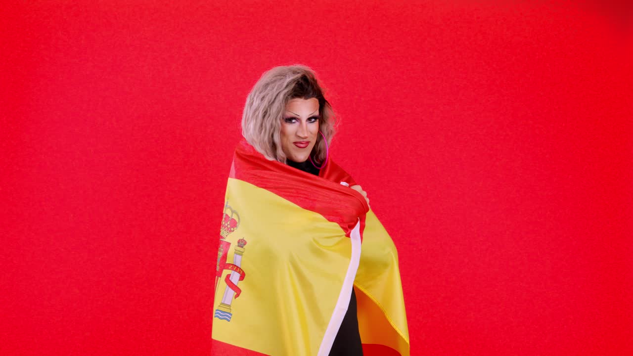 Drag queen wrapped in a Spanish flag