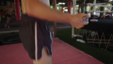 A person skipping rope as part of a workout in a gym