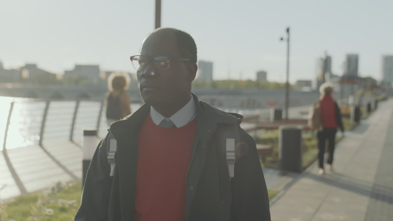 African American Businessman Walking in City in Morning